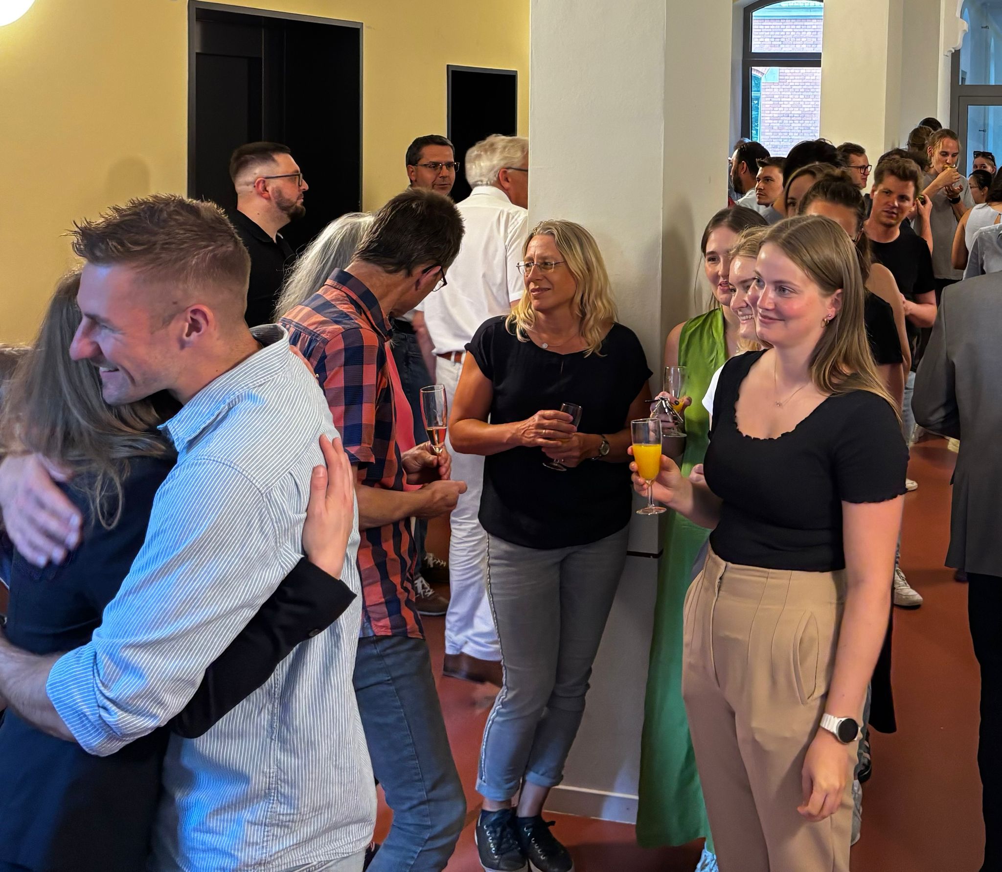 Collegues and guest congratulating the new doctor