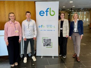 A picture of three females and one male representatives of BVT at the conference